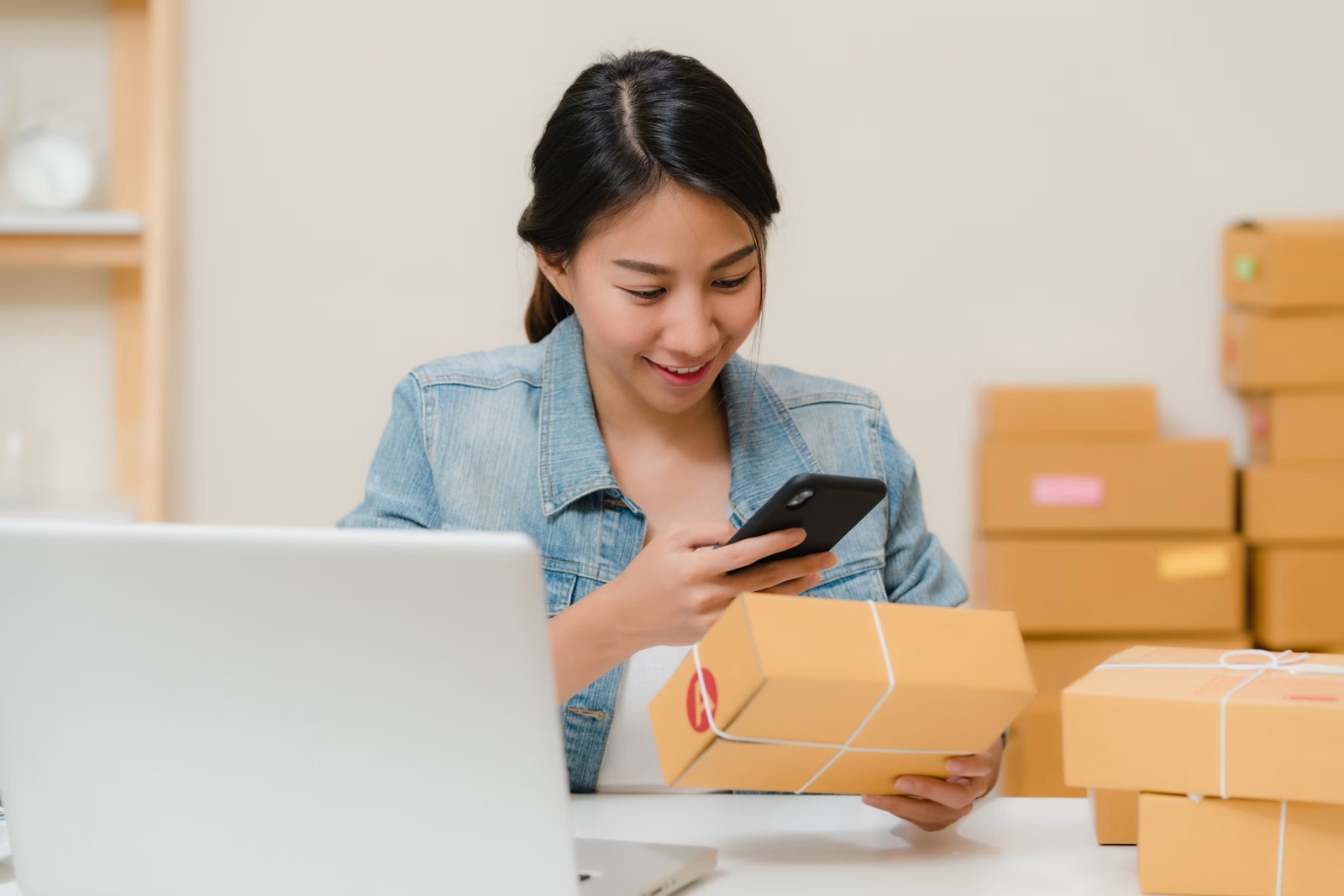 A woman photographing the label on a delivered package
